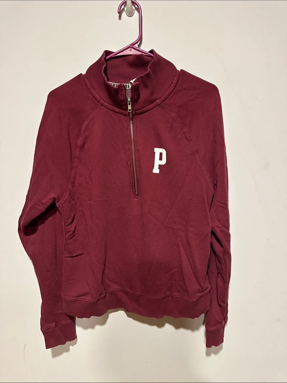 pink half zip pull over